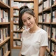Lin, a 27-year-old Asian woman in a bookstore on MagnoliaDate dating platform